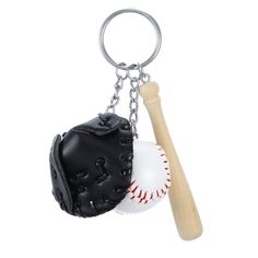 a baseball and glove keychain with a wooden bat on the back ground, isolated against a white background