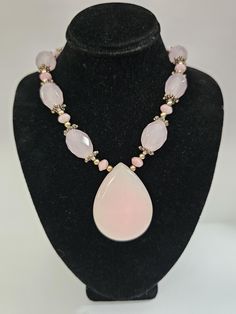 The large milky pink beads are faceted & smooth to the touch! They have pretty flower spacers pm each side of the pink beads & little pink seed beads too! All the metal is silver plated, including the flower spacers & the lobster claw clasp.  Arrives in a box, perfect for gift giving. Large Bead Necklace Ideas, Milky Pink, Large Bead Necklace, Stone Beaded Necklace, Pretty Flower, Pink Beads, Bead Jewellery, Glass Bead Necklace, Pink Glass