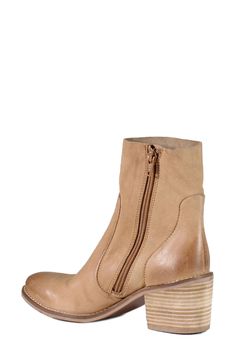 Ground a variety of ensembles in classic style with this sleek leather bootie raised on a stacked heel and cushioned footbed. Leather upper and lining/synthetic sole Imported Leather Booties, Cashew, Stacked Heel, Wedge Boot, Bootie, Classic Style, Ankle Boot, Leather Upper, Wedges