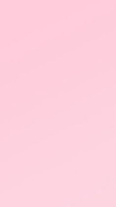 a pink background with an airplane flying in the sky