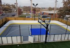 an outdoor basketball court in the middle of a city