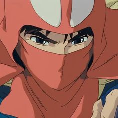 an anime character with blue eyes wearing a red hoodie and looking at the camera