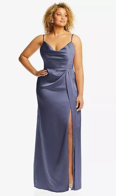 a woman in a long blue dress with a slit on the side and one leg