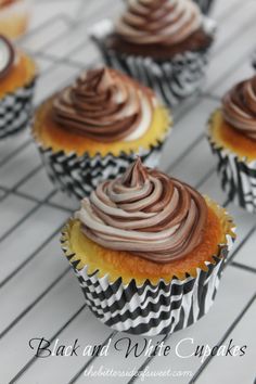 cupcakes with chocolate frosting sitting on a cooling rack