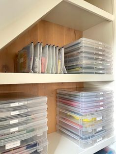 the shelves are filled with plastic containers and file folders for organizing or storing files