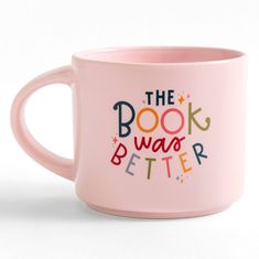 a pink coffee mug with the words book was better printed in multicolored letters