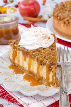 a slice of apple pie on a plate with whipped cream and caramel toppings