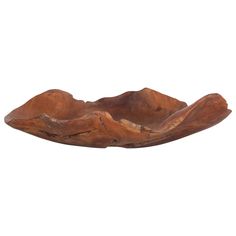 a wooden bowl that is shaped like mountains