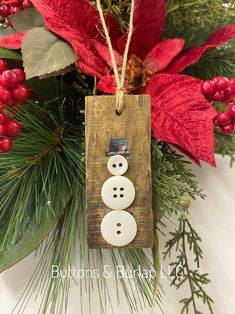 a wooden ornament with a snowman on it