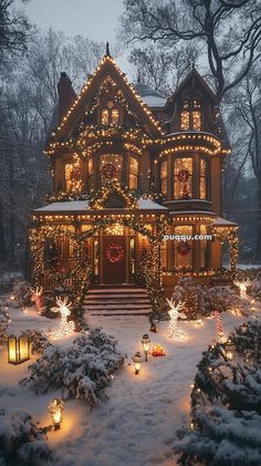 a large house covered in christmas lights and decorated for the holidays with snow on the ground