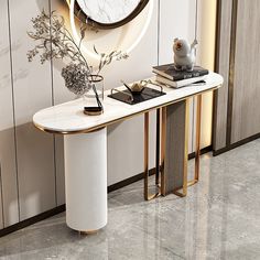 a console table with a vase and flowers on it in front of a wall mounted clock