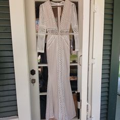 Crochet Gown With Mesh Backing And Mermaid Bottom. Size Small Long Evening Gown For Spring, White Long Sleeve Maxi Dress For Prom, White Spring Party Gown, White Long Maxi Dress For Evening, Chic Fitted White Gown, Chic White Long Sleeve Gown, White Long Gown For Spring, White Long Party Gown, White Spring Formal Gown