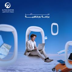 a man sitting on the ground with a laptop in his lap while flying through the air