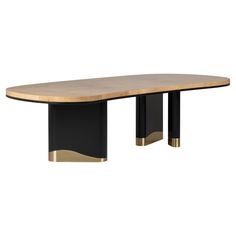 a black and gold dining table with an oval wooden top