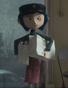 the doll is holding a paper bag in her hand