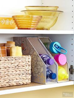 two shelves filled with bowls and cups on top of each other