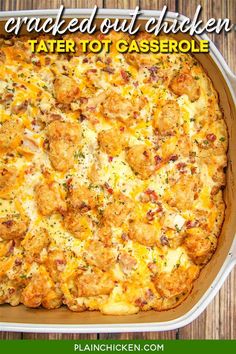 baked out chicken tater tot casserole in a white dish on a wooden table