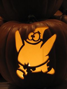 a carved pumpkin with an image of pikachu on it