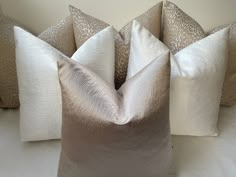 four pillows sitting on top of each other