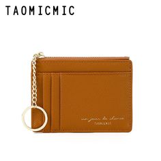 a tan card case with a keychain hanging from it's front pocket