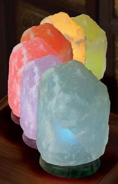 three different colored rocks sitting on top of a table