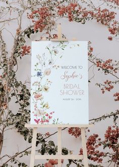 an easel with a sign that says welcome to the bride's bridal shower