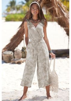 Step into the world of fashion with this jumpsuit, a trendy choice for every woman. Elegant Overall Jumpsuits And Rompers For Vacation, Chic V-neck Jumpsuits And Rompers For Beach Season, Elegant Vacation Jumpsuits And Rompers In Overall Shape, Elegant Vacation Overalls And Rompers, Elegant Jumpsuits And Rompers For Vacation, Trendy Beach Overall Jumpsuits And Rompers, Trendy Beach Overalls And Rompers, Spring Vacation Overall Jumpsuits And Rompers, Vacation Spring Overalls And Rompers