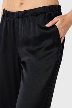 Made from 100% Silk, the Wide Leg Pant in Silk is luxurious and effortlessly elegant. These mid-rise, pull-on pants feature a soft elastic waistband and side seam pockets. Cut from the finest silk, these pants have gorgeous movement and drape. Dress them up, or dress them down - they are a timeless wardrobe staple. Made in the USA100% Silk Model is 5'9" wearing a size 2 for length Usa Shorts, Usa Sweatshirt, Drape Dress, Timeless Wardrobe, Timeless Wardrobe Staples, Women's Bottoms, Sweatpants Shorts, Usa Dresses, Wide Leg Pant