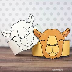 two paper animals are sitting next to each other