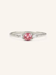 Every story deserves to be told. Just like the flower that lends inspiration to our forget me not ring, this piece will become an unforgettable memory. The center stone is adorned by two diamonds, lending it a remarkable look that is sure to be cherished. Pink Three Stone Ruby Ring, Elegant Pink Ruby Three Stone Ring, Elegant Three Stone Tourmaline Jewelry, Elegant Pink Three-stone Ruby Ring, Elegant Three Stone Pink Sapphire Jewelry, Elegant Pink Three Stone Rings, Elegant Pink Tourmaline Birthstone Ring, Pink Birthstone Promise Ring With Rose Cut Diamonds, Pink Three Stone Promise Ring