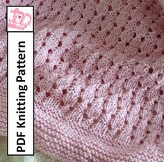 a pink knitted blanket sitting on top of a white tablecloth with the words, do