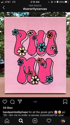 a pink canvas with flowers and the word mom painted on it