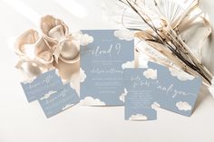 the wedding stationery is laid out on top of each other