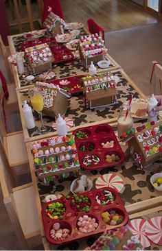 the table is set up with candy and candies