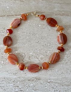 Orange Striped Agate Necklace featuring 35MM oval orange striped agate stones accented with carnelian nuggets and fire opal Swarovski crystals and gold plated spacers. Gold filled toggle clasp. GIFT BOXED Orange Necklaces, Orange Choker, Fire Agate Jewelry, Orange Jewelry, Necklace Orange, Carnelian Necklace, Bracelet Display, Necklace Chunky, Charms Bracelet