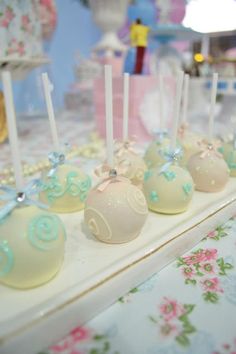 there are many cake pops on the table