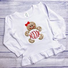 'Tis the season for extra cute monogram tops for kids. Our favorite Christmas shirts designs bring style, sweetness, and holiday cheer to your little ones favorite time of year. Cute gingerbread girl shirt for kids Please use the drop down arrows to select [Size] and [Style] In the text box please add [Name] or [Initials (first, Last, middle)] or [Phrase] you want added to the design If no text is entered it will be left blank Shop our online kids boutique with custom embroidery outfits, monogra Christmas Initial Shirts, Monogram Shirts Vinyl, Embroidery Outfits, Christmas Shirts Vinyl, Christmas Applique Designs, Girls Christmas Shirts, Monogram Kids, Cricut Christmas Ideas, Holiday Embroidery