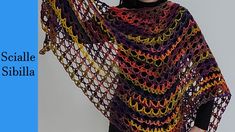 a woman wearing a multicolored crocheted shawl with the words, scallie sheila on it