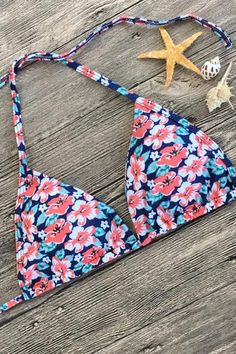 Tropical two piece bikini set features a sliding triangle bikini swim top with detachable pad cups, adjustable straps tie on neck and back, matching with a low rise bikini bottom with self tie side straps. Allover in mini floral print. Size Guide: Size (in) US Bust Waist Hip S 4-6 32-34 24-26 34-36 M 8-10 34-36 26-28 36-38 L 12-14 36-38 28-30 38-40 Vacation Swimwear With Padded Cups And T-back, Vacation Swimwear With Adjustable Straps And T-back, Tropical Triangle Halter Top With Adjustable Straps, Summer Swimwear With Padded Cups And T-back, Strappy Swimwear With Padded Cups For Vacation, T-back Swimwear With Adjustable Straps For Beach, Padded T-back Swimwear For Beach Season, Summer Beach Halter Top With Padded Cups, Beach Season Swimwear With Padded Cups