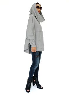 "* ALL ORDERS ARE SHIPPED VIA DHL EXPEDITED MAIL * Killer cool in one easy piece with pullover hood sweater. Features an oversized roomy hood, batwing sleeves with cuffed, a kangaroo pocket and rounded hem. Dreamy to wear day to night. * Hooded * Dropped shoulders * Batwing sleeves with cuffed * A kangaroo pocket * Rounded hem Measurements approximately: Bust: 76\" (193 cm) Sleeve length (from side of neckline): 27\" (68.5 cm) Cuff Sleeve: The cuff can stretch from 8\" (20 cm) up to 12\" (30.5 c Winter Tops With Kangaroo Pocket And Relaxed Fit, Relaxed Fit Winter Tops With Kangaroo Pocket, Winter Relaxed Fit Tops With Kangaroo Pocket, Winter Oversized Top With Kangaroo Pocket, Fall Stretch Tops With Kangaroo Pocket, Stretch Tops With Kangaroo Pocket For Fall, Gray Funnel Neck Hoodie For Fall, Trendy Oversized Top With Adjustable Hood, Relaxed Fit Funnel Neck Hoodie For Fall