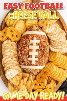 a football cheese ball surrounded by crackers and crackers