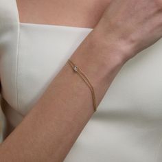 Like the embrace equity pose, the gold strands of the embrace equity bracelet hug the single center diamond signifying the importance of one, the sanctity of many, and the promise of a world where difference is valued and celebrated and where women?s equality and privilege of equity is forged into our reality. Embrace yourself, embrace this timeless jewel, embrace equity. Gold Wedding Bracelet With Single Diamond, Wedding Gold Bracelet With Single Diamond, Gold Bracelet With Single Diamond For Wedding, Elegant Diamond Bracelet With Si Clarity For Anniversary, Timeless Gold Bracelet With Single Diamond, Yellow Gold Wedding Bracelet With Single Diamond, 14k Gold Bracelet With Single Diamond For Wedding, Wedding 14k Gold Diamond Bracelet With Single Diamond, 14k Gold Bracelet With Ethical Diamonds For Wedding