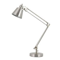 a metal desk lamp on a white background