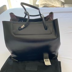 Black Leather. Purple Croc Leather On The Sides. Great Condition. No Scratches, Clean Inside. Detachable Pouch Inside. Dust Bag Included. Alexander Wang Rocco, Alexander Wang Bag, Seven Jeans, Croc Leather, Black Leather Tote, Burberry Handbags, Gucci Sunglasses, Jeffrey Campbell Shoes, Givency Antigona Bag