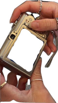 a person holding an old cell phone in their left hand, with the screen partially removed