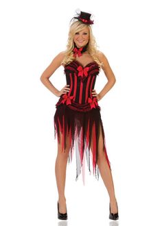 a woman wearing a costume with red and black stripes on the bottom, while standing in front of a white background