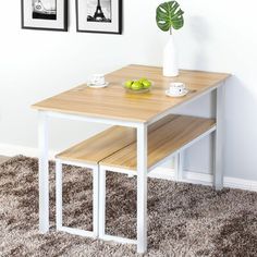 a wooden table with two benches underneath it