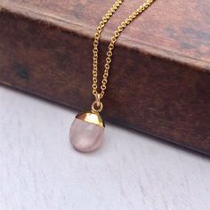 Rose Quartz Necklace, Rose Quartz Oval Pendant, Blush Pink Gold Necklace, Neutral Minimalist Layering Jewelry, Pink Jewelry Gift for women This simple dainty necklace features a tiny genuine rose quartz oval pendant dipped in your choice of 14k Gold Filled or Sterling Silver. The blush pink pendant is suspended from a delicate chain in the finish of your choice. This is a 100% rose quartz gemstone, full of healing properties. This necklace is simply perfect for everyday wear and is perfect for l Rose Quartz Gold Necklace, Feminine Teardrop Pendant Necklace, Minimalist Pink Clavicle Chain Necklace, Elegant Pink Necklaces For Everyday, Elegant Pink Necklace For Everyday Wear, Elegant Pink Necklace For Everyday, Elegant Blush Necklace For Gift, Feminine Rose Gold Necklace For Everyday, Dainty Oval Rose Gold Necklace