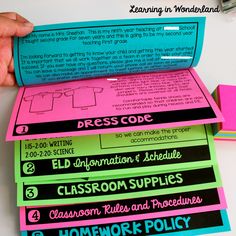 a pile of classroom supplies sitting on top of a white table next to each other