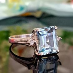 2.50 Carat Natural Aquamarine & Diamonds 14k Solid Gold Ring Ring Material: 14k Solid Gold Total Metal Weight: 2.7 Grams Gemstone: Natural Aquamarine Gemstone Color: Pale Blue (Aqua) Gemstone Shape: Emerald Gemstone Dimensions: 9.00x7.00 mm Gemstone Carat Weight: 2.40 Carat Gemstone Quantity: 1 Diamonds: Natural Round Shaped Diamonds Quantity: 2 Diamonds Total Carat Weight: 0.10 Carat Total Carat Weight: 2.50 Carat Ring Quantity: One Ring Condition: New Made in the USA Delivered in an elegant gi Gia Certified Silver Topaz Ring For Anniversary, Gia Certified Baguette Cut Topaz Ring Gift, Gia Certified White Gold Gemstones For Anniversary, Gia Certified White Gold Topaz Ring Gift, Classic Gia Certified Topaz Ring For Gift, Gia Certified Baguette Cut Topaz Ring For Anniversary, Gia Certified Blue Topaz Diamond Ring Gift, Anniversary Blue Topaz Diamond Ring Gia Certified, Gia Certified Blue Topaz Diamond Ring For Anniversary